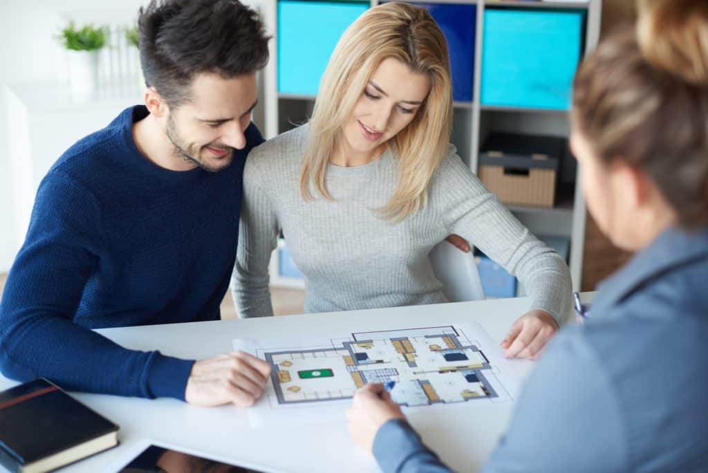 Couple meeting with real estate agent
